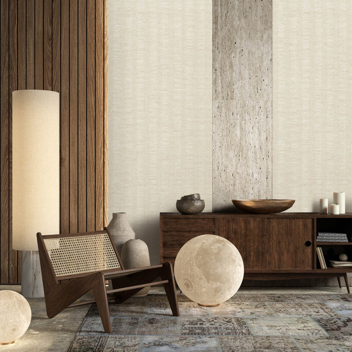 GoDear_Design_Modern interior design with a wooden chair, lamp, and decorative items against a textured wall.