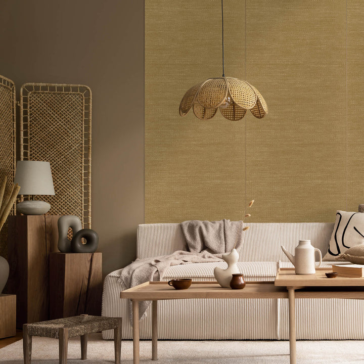 Modern living room with a sofa, coffee table, and decorative items.