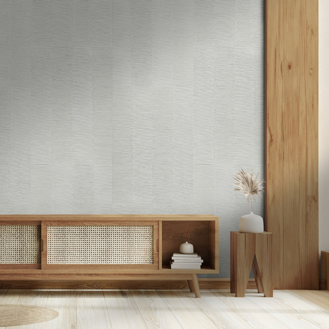 Modern interior with wooden furniture against a textured wall.