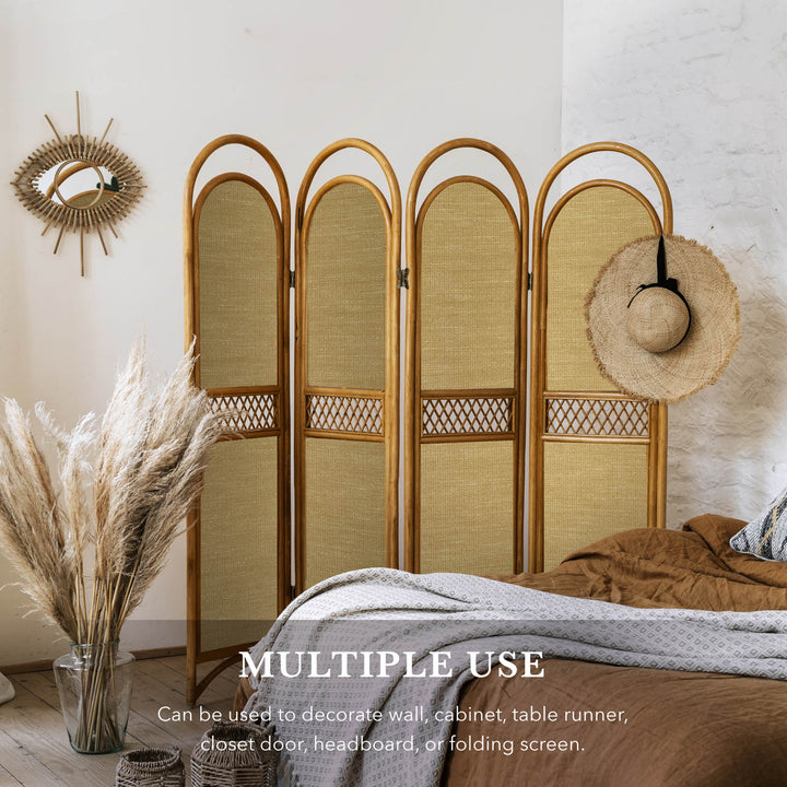 Woven room divider in a bedroom setting with decorative elements.