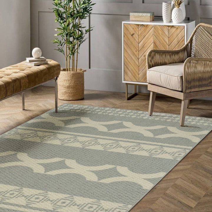 Living room with a patterned rug, wooden chair, and side table.