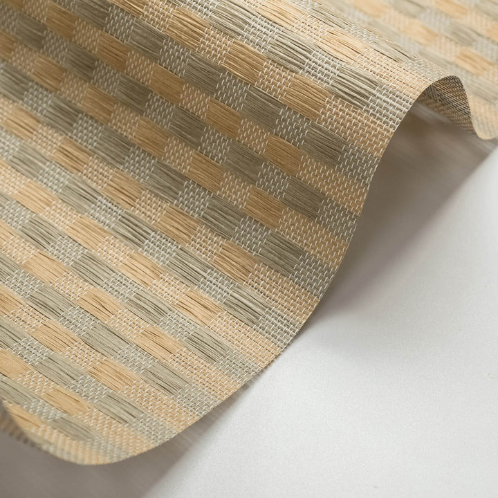 Close-up of a textured beige and brown patterned material