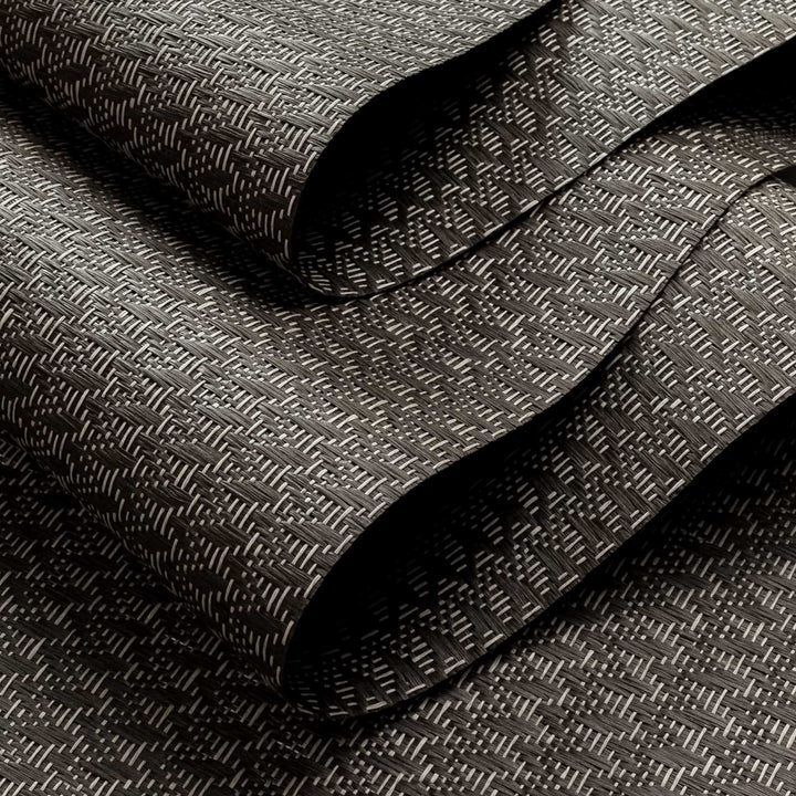 Dark gray textured fabric with a subtle pattern