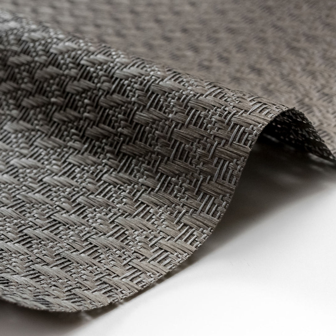 Close-up of textured gray fabric on a white background