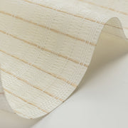 Close-up of a textured beige paper roll on a light background