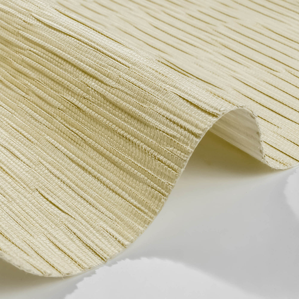 Close-up of beige pleated fabric on a white background