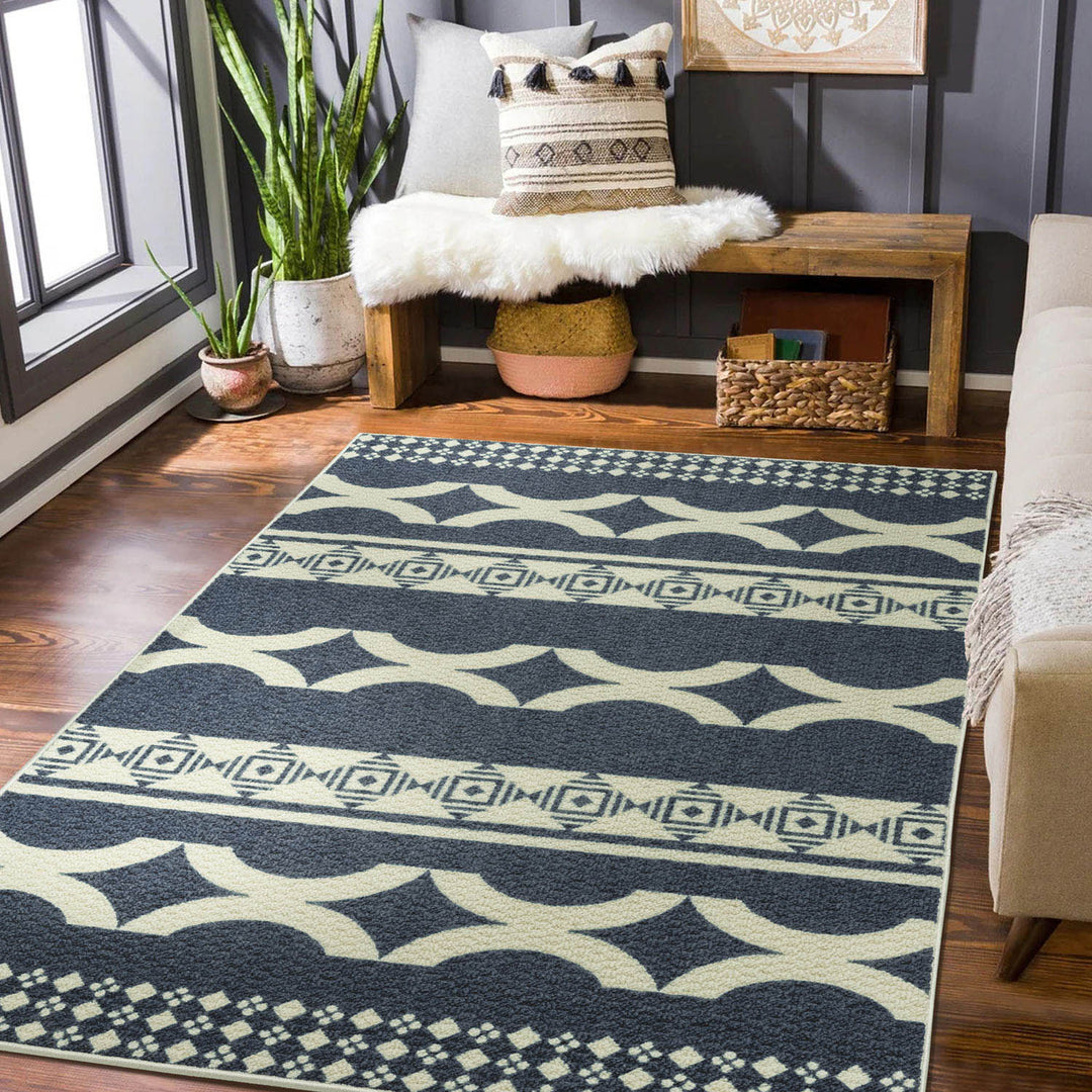 Patterned rug on a wooden floor with a bench and decorative items in the background