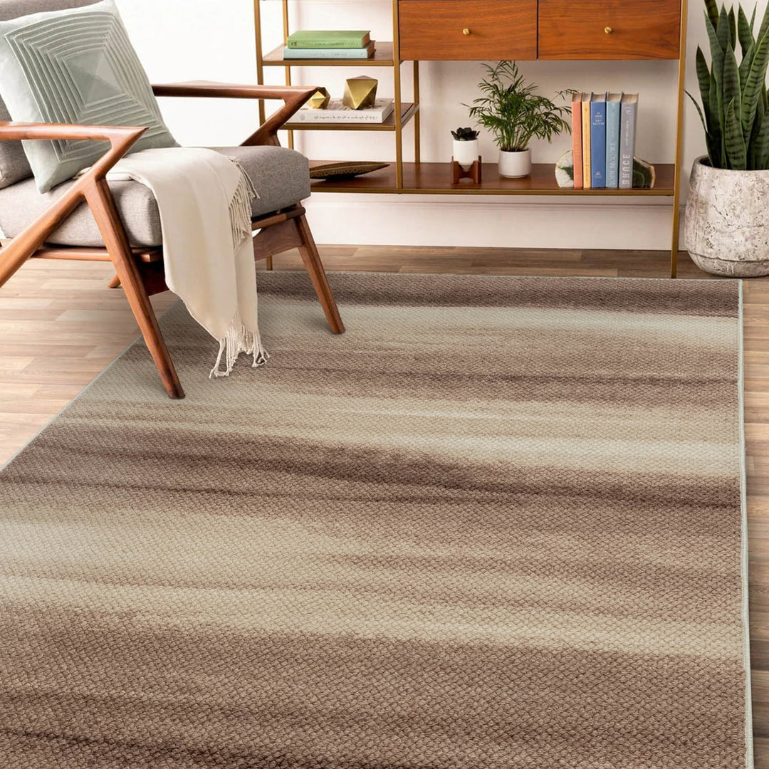 Striped area rug in a living room setting with a chair and books.