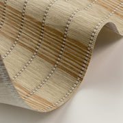 Close-up of woven fabric with brown and beige stripes on a neutral background