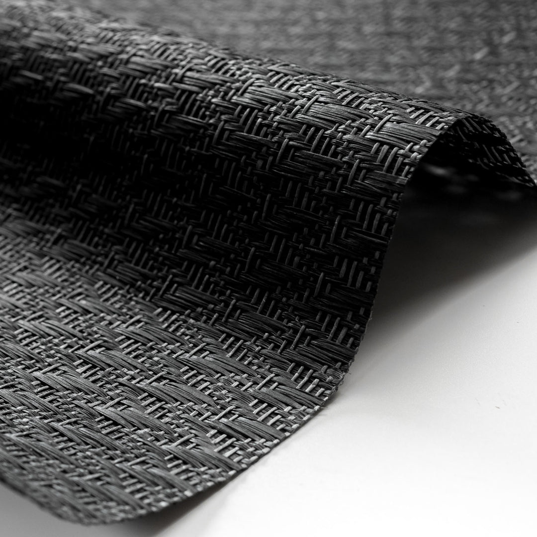 Close-up of textured black fabric on a white background