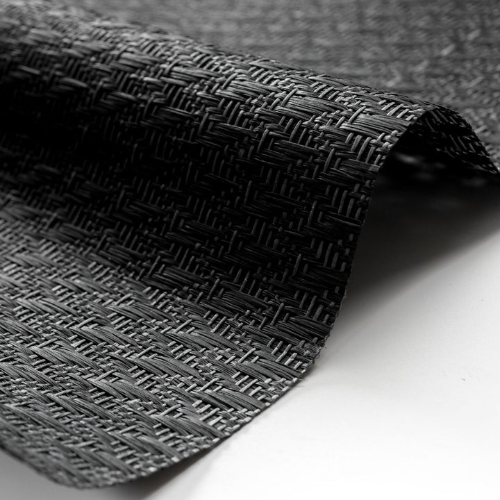 Close-up of textured black fabric on a white background