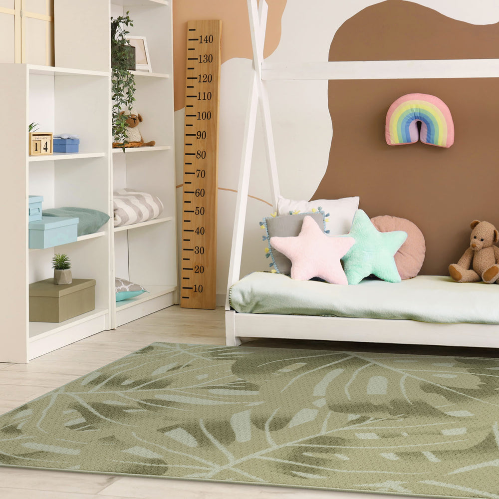 Children's room with a bed, colorful pillows, and a growth chart on the wall.