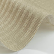 Close-up of beige pleated woven material with subtle stripe texture and natural fiber appearance.