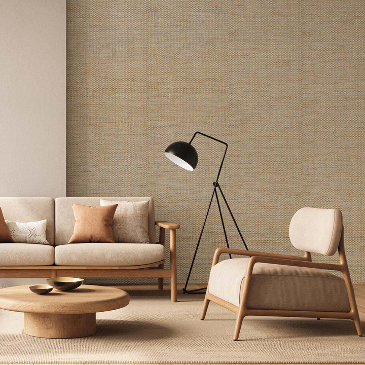 Cozy minimalist living room featuring beige woven texture wallpaper, wooden sofa and armchair, round coffee table, and modern black floor lamp.