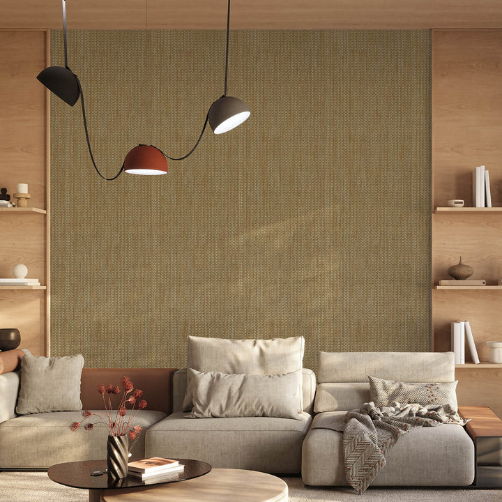 Modern living room with a textured wall, gray sofa, and decorative items.