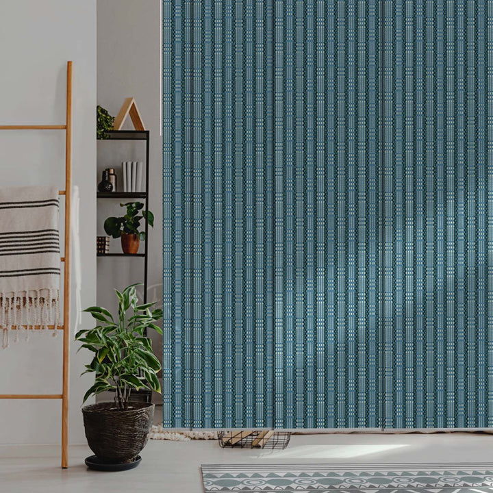 GoDear Design Room interior with a textured blue wall panel, plant, and shelves.