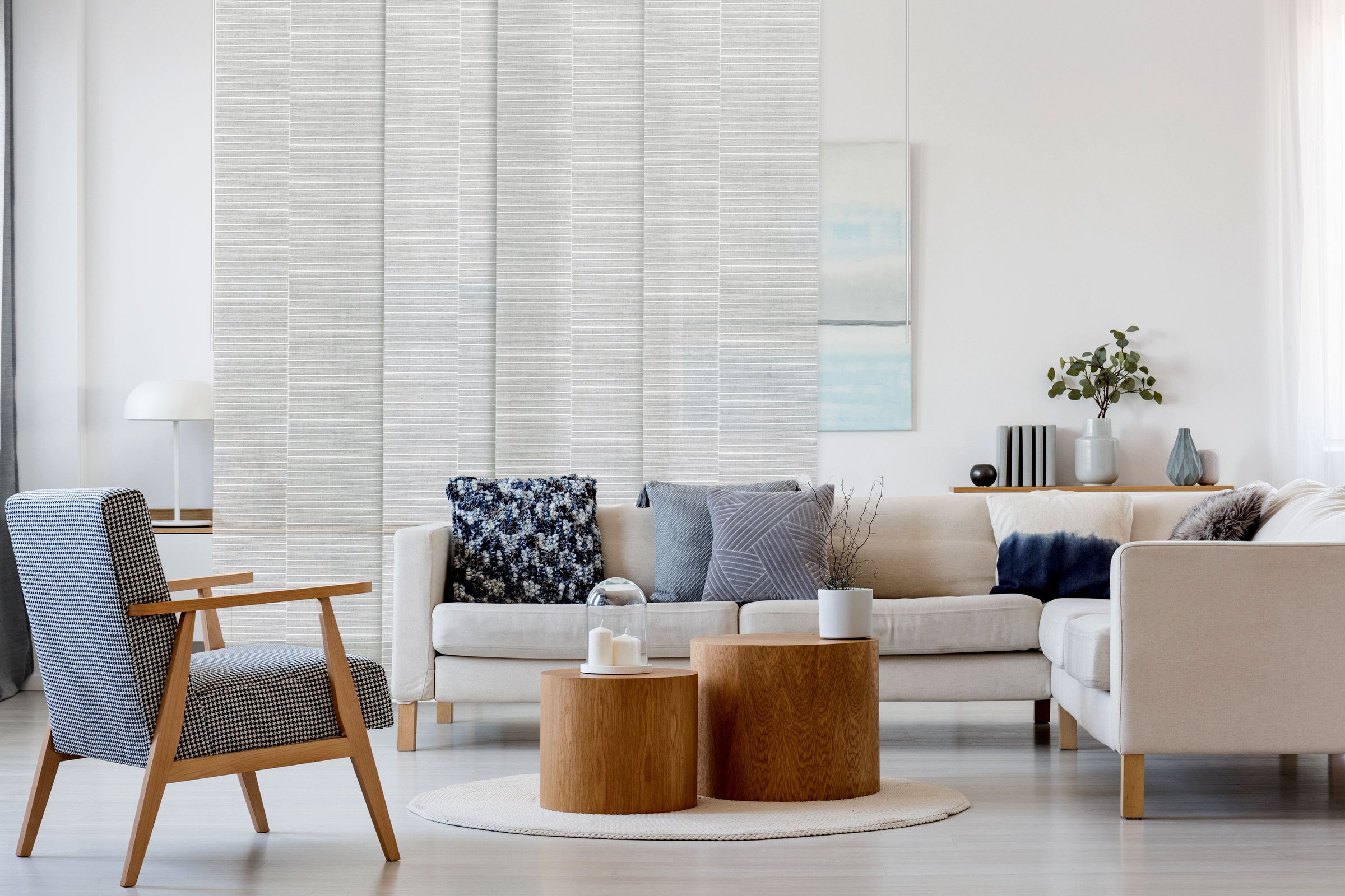 GoDear Design_Modern living room with beige sofa, armchair, and wooden coffee table.