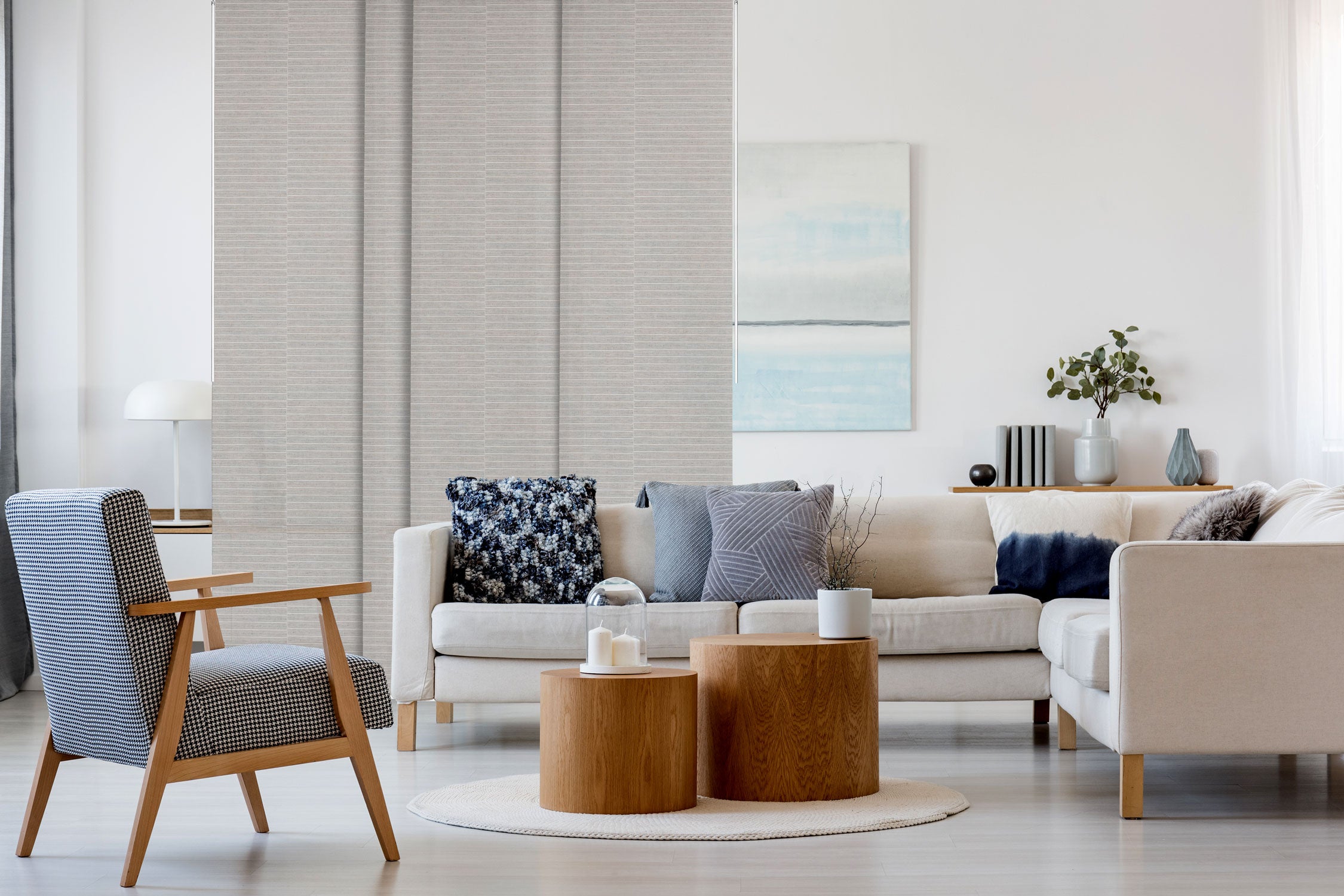 GoDear Design_Modern living room with beige sofa, armchair, and wooden coffee table.