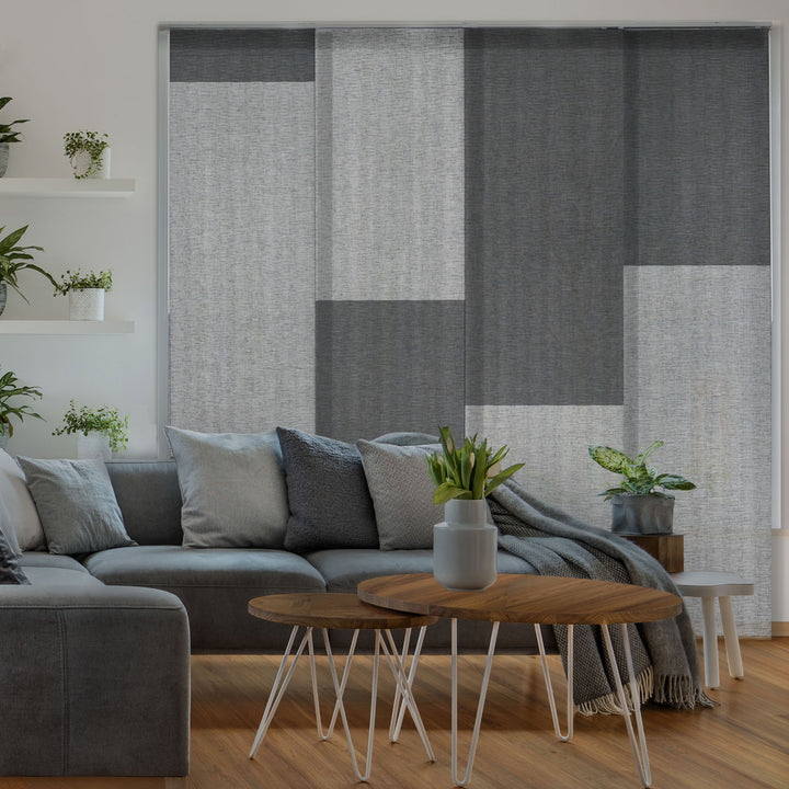 GoDear Design Living room with a gray sectional sofa, wooden coffee table, and decorative plants.