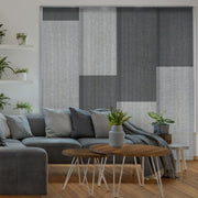 GoDear Design Living room with a gray sectional sofa, wooden coffee table, and decorative plants.