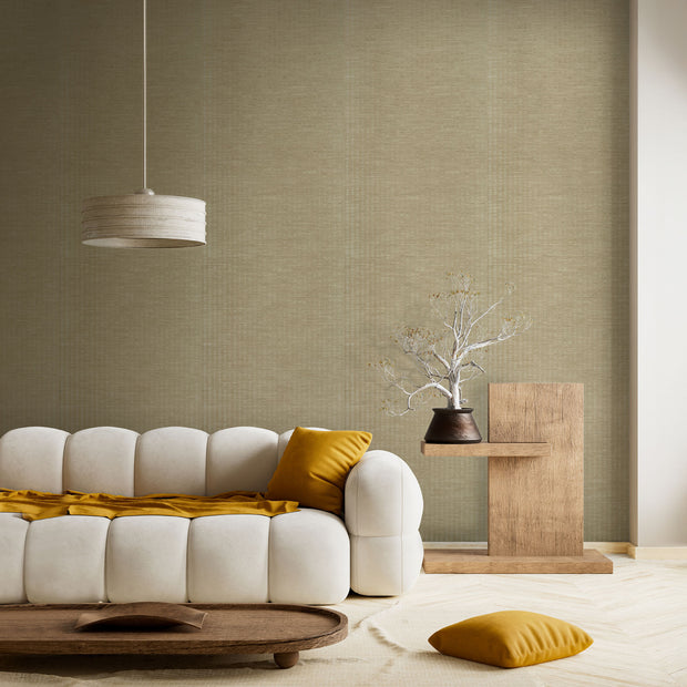 Minimalist living room with a cream tufted sofa, mustard accents, a wooden side table, and a warm beige textured wall.