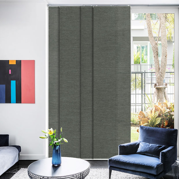 Living room with gray vertical blinds, blue armchair, and abstract art on the wall.