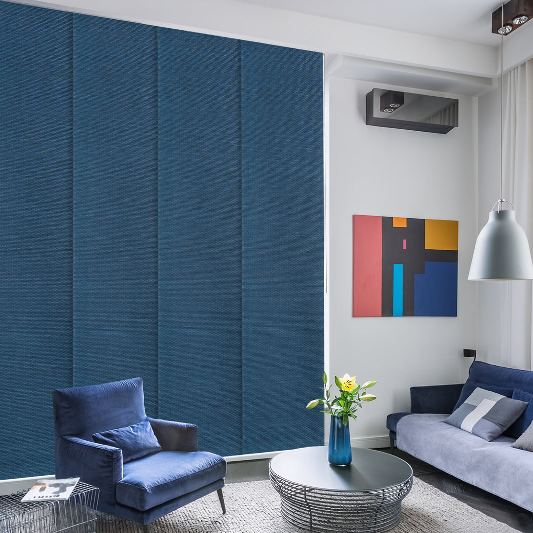 GoDear Design Modern living room with blue walls, a sofa, and a coffee table.