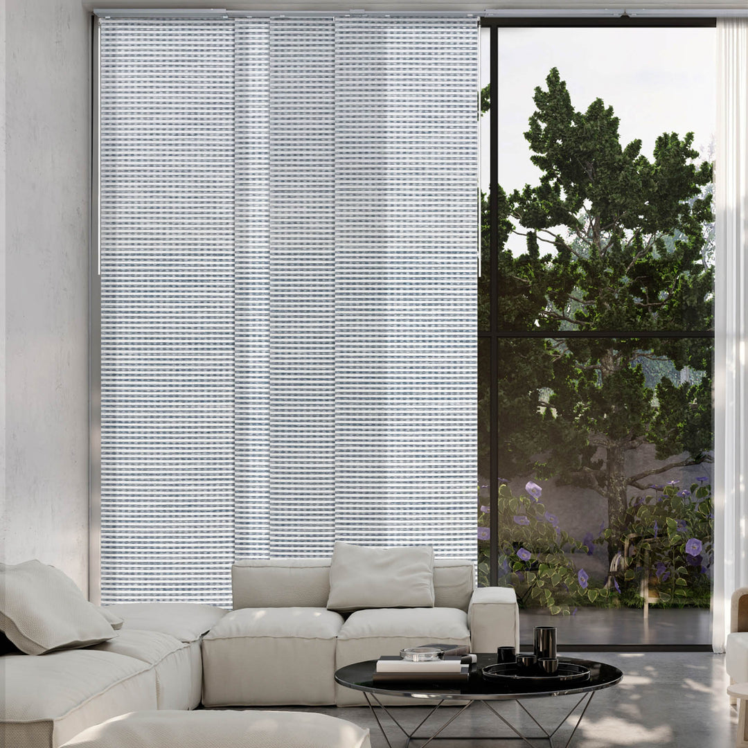 GoDear Modern living room with a large window featuring white vertical blinds and a view of greenery outside.