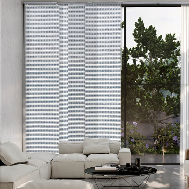 GoDear Modern living room with a large window featuring white vertical blinds and a view of greenery outside.