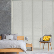GoDear Design Bedroom with gray blinds covering a large window, wooden bed, and chair with yellow cushion.