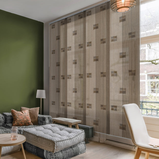 GoDear Design Living room with patterned curtains, a sofa, and a chair.