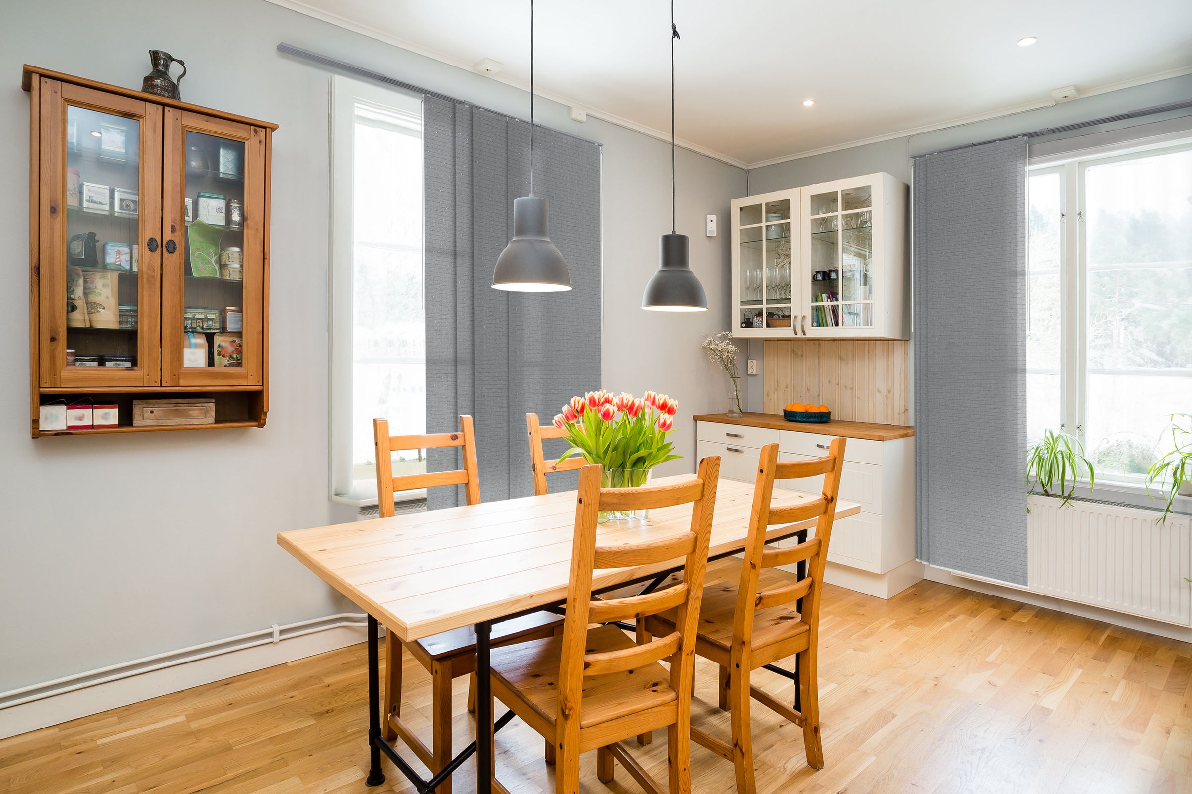 GoDear Design_Modern kitchen with wooden dining table and chairs, glass cabinet, and large windows.