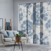 GoDear  Living room with a sofa, coffee table, and tie-dye patterned window blinds.