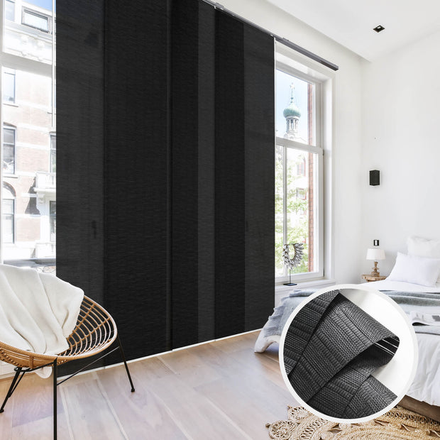 GoDear Design Black roller blind in a room with a chair and bed.