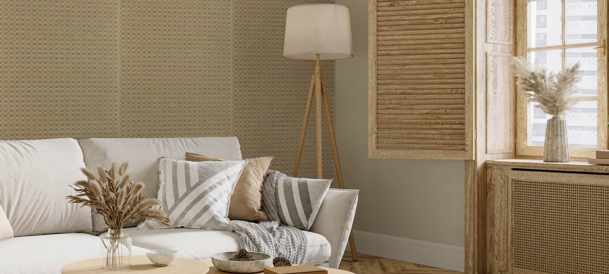 Living room with a beige sofa, striped cushions, and a lamp.