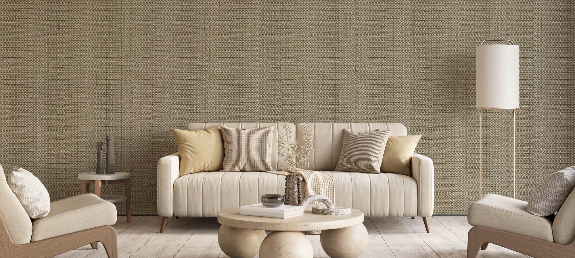 Neutral living room with textured feature wall, cream sofa, and modern accent chairs.