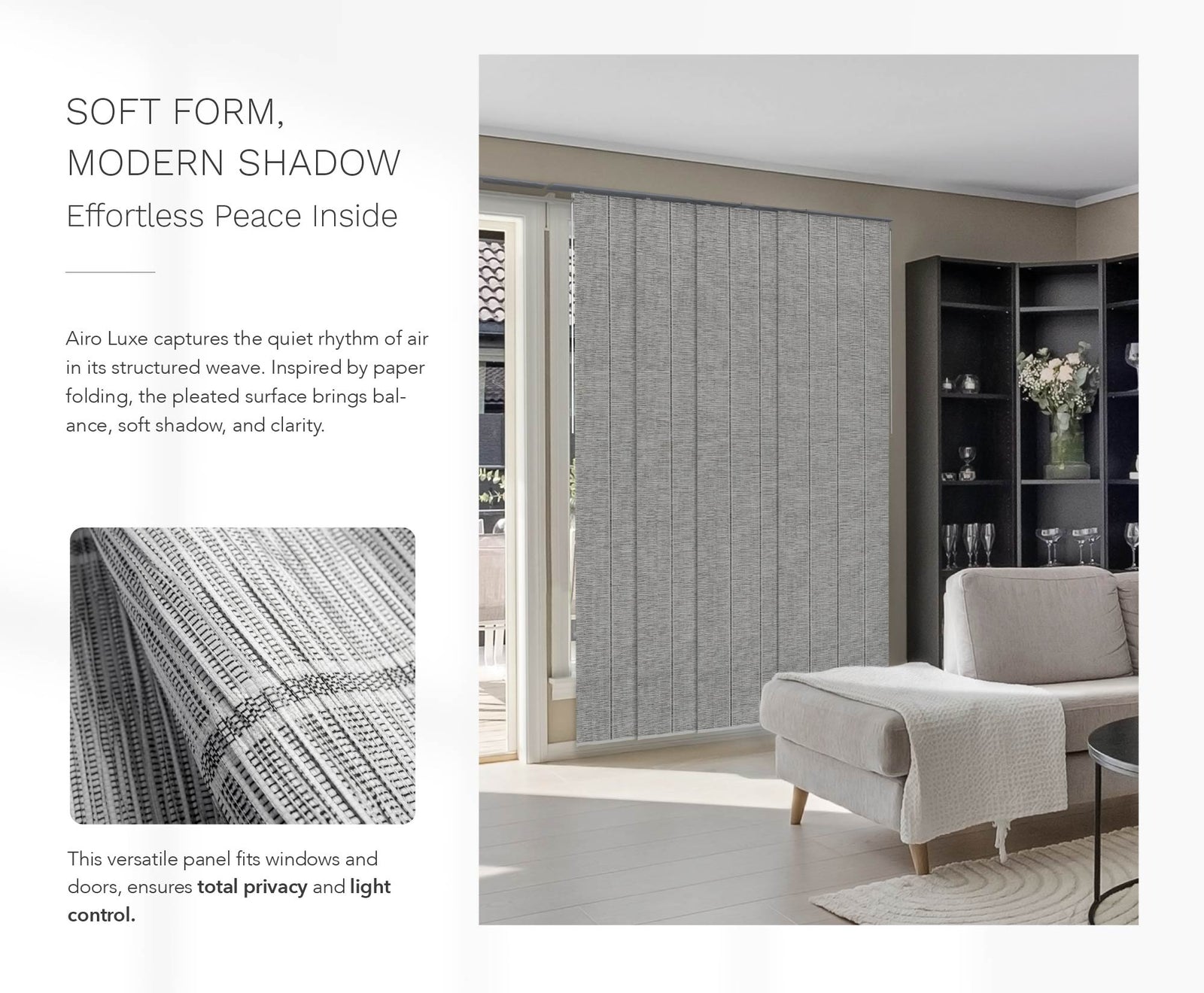 Sunlit modern living room with light grey pleated wall panels, a cream lounge chair draped in a knitted throw, and a black shelving unit with glassware and flowers, creating a peaceful and refined interior setting.