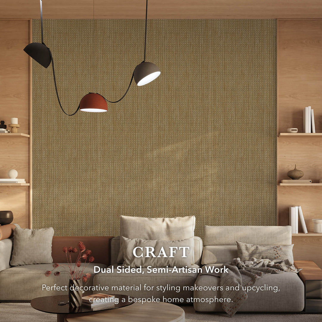 Contemporary living room with a large woven-texture wallpaper feature wall in earthy beige tones, complemented by neutral sofas, wooden shelving, and modern pendant lighting, with text overlay describing the fabric’s dual-sided, semi-artisan craftsmanship.