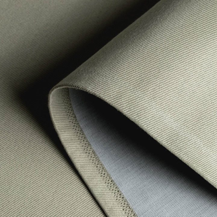 GoDear Design Close-up of textured fabric in shades of gray and beige.