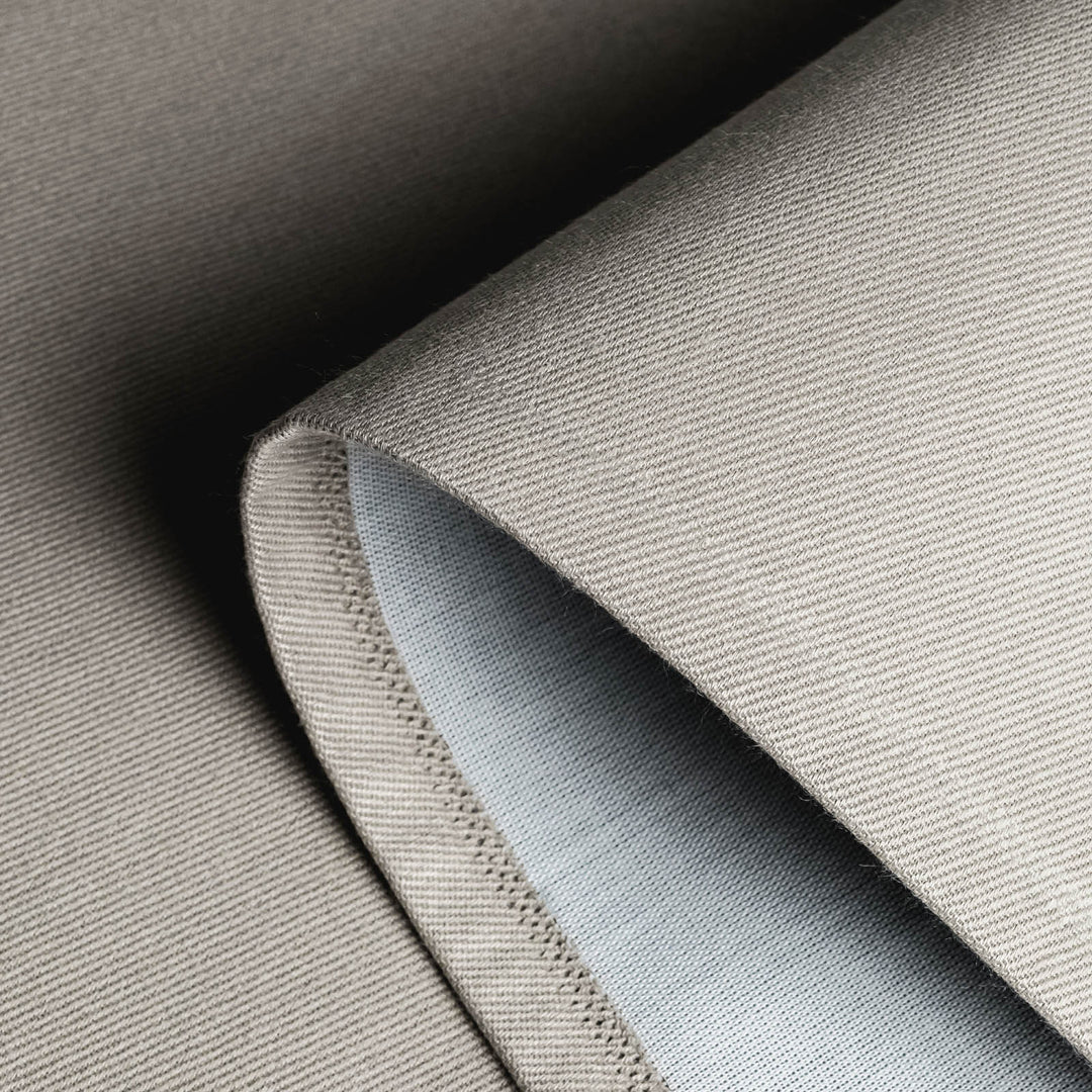GoDear Design Close-up of textured fabric with a focus on stitching detail