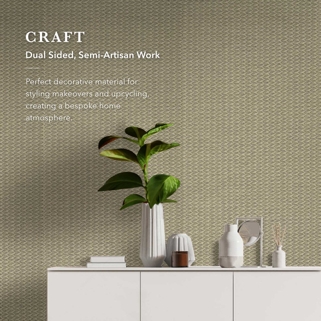 Decorative wallpaper with text about dual-sided, semi-artisan work and a plant on a shelf.