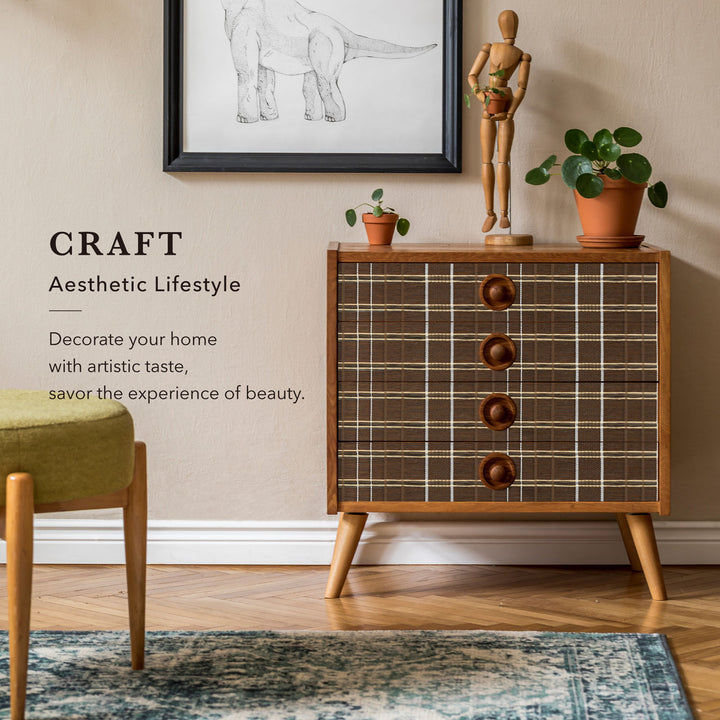 Wooden dresser with plaid pattern and wooden knobs in a room with decor elements.