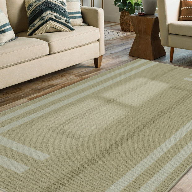 Green striped rug in a living room setting with a beige sofa and wooden coffee table.