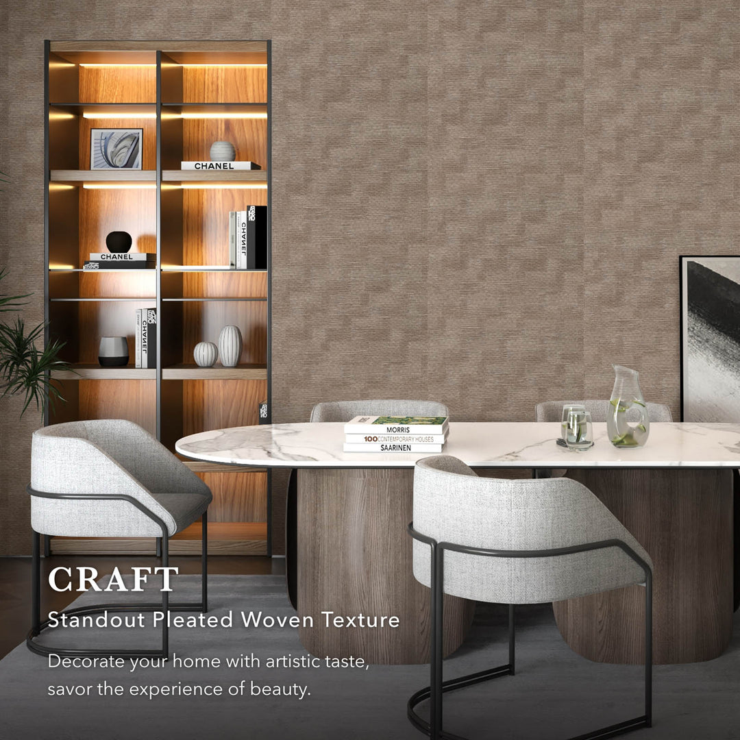 Dining room with a table, chairs, and a bookshelf against a textured wall.