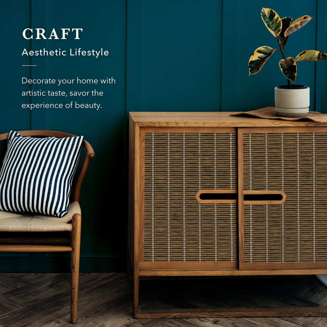 Wooden cabinet with a chair and plant against a teal wall, promoting an aesthetic lifestyle.