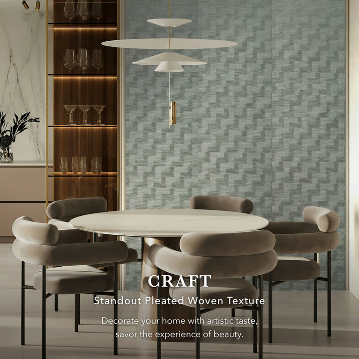 Dining room with a round table and chairs, featuring a textured wall and modern decor.