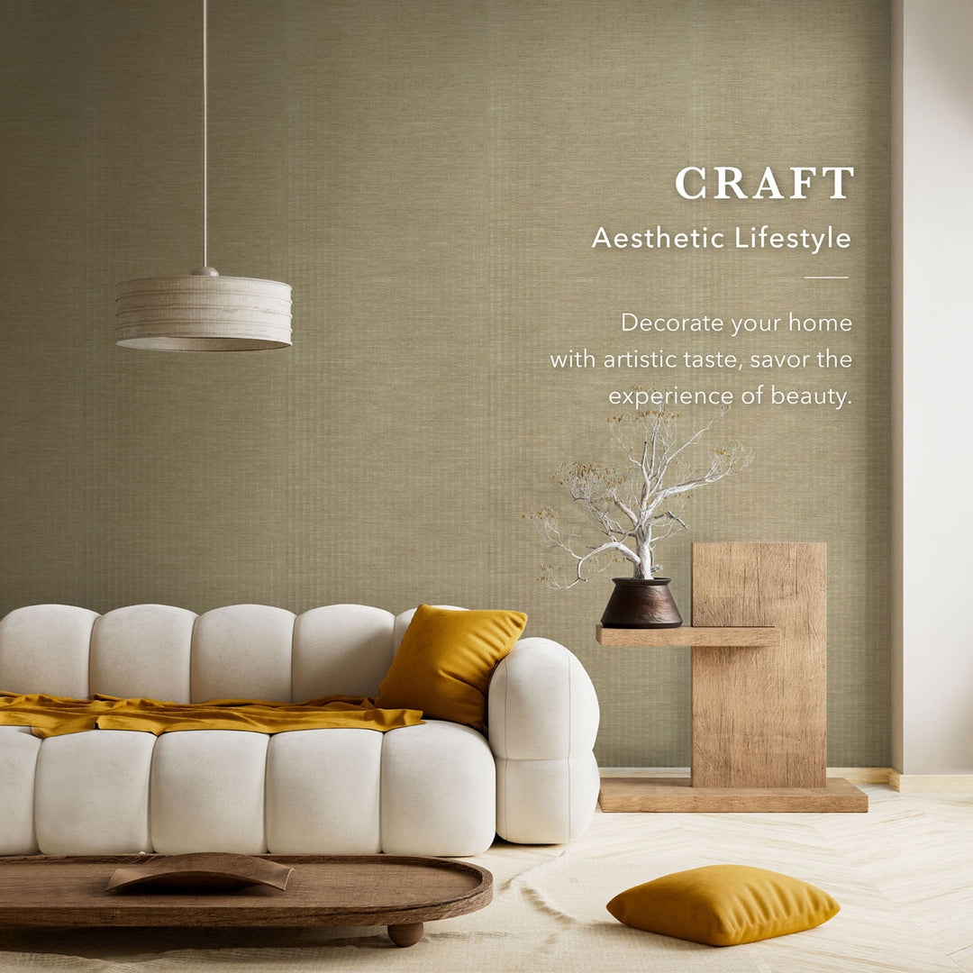 Modern living room with a white sofa, yellow cushions, and a wooden side table against a textured wall.