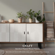 White cabinet with pleated woven texture in a room with plants and a ladder.