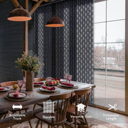Dining room with a large window, wooden table, and chairs, featuring adjustable track curtains.