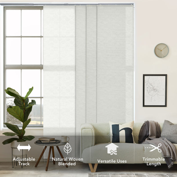 GoDear Living room with a window featuring woven blinds, a couch, and decorative elements.